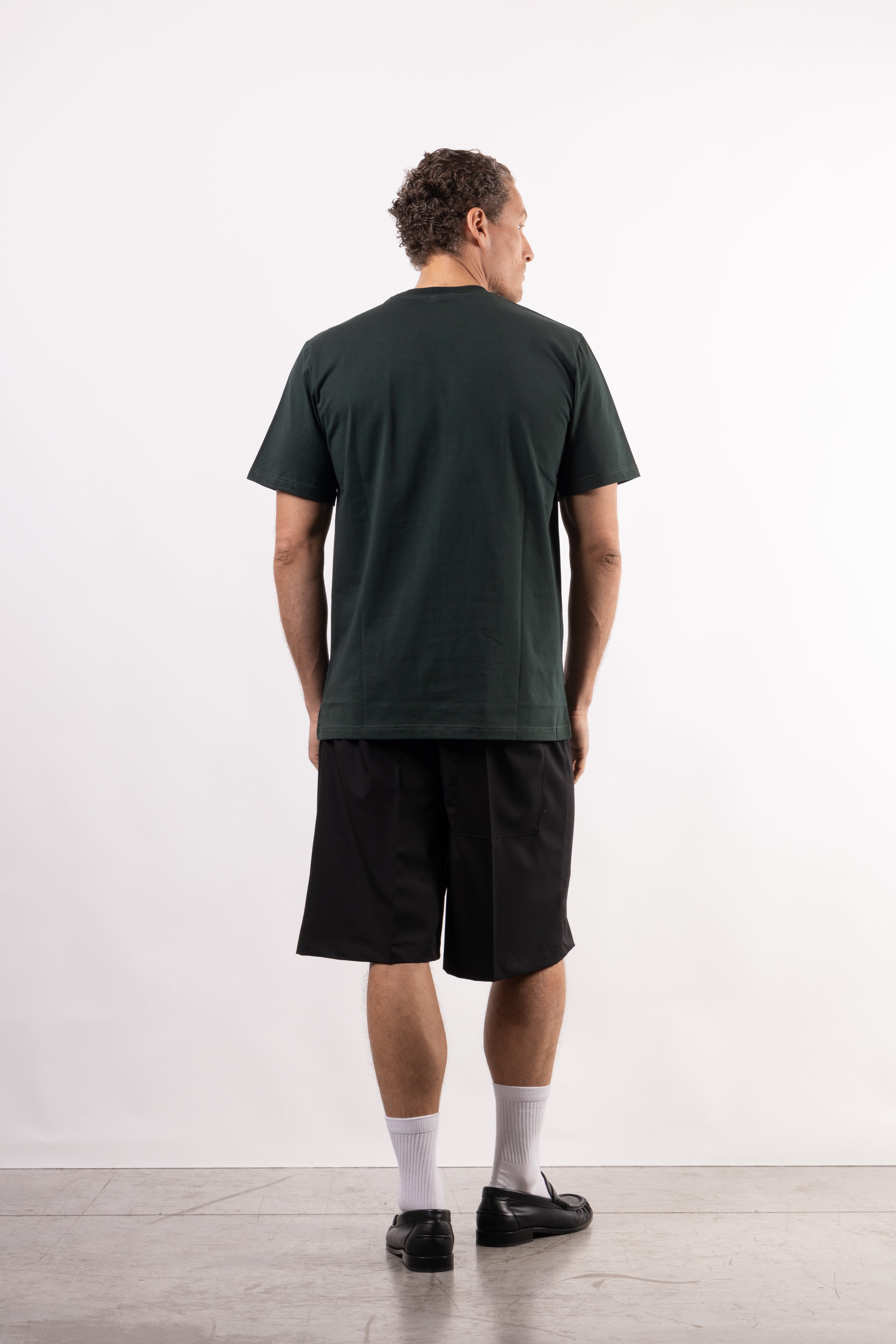 T-shirt in 100% cotone con placchetta in pelle lato cuore