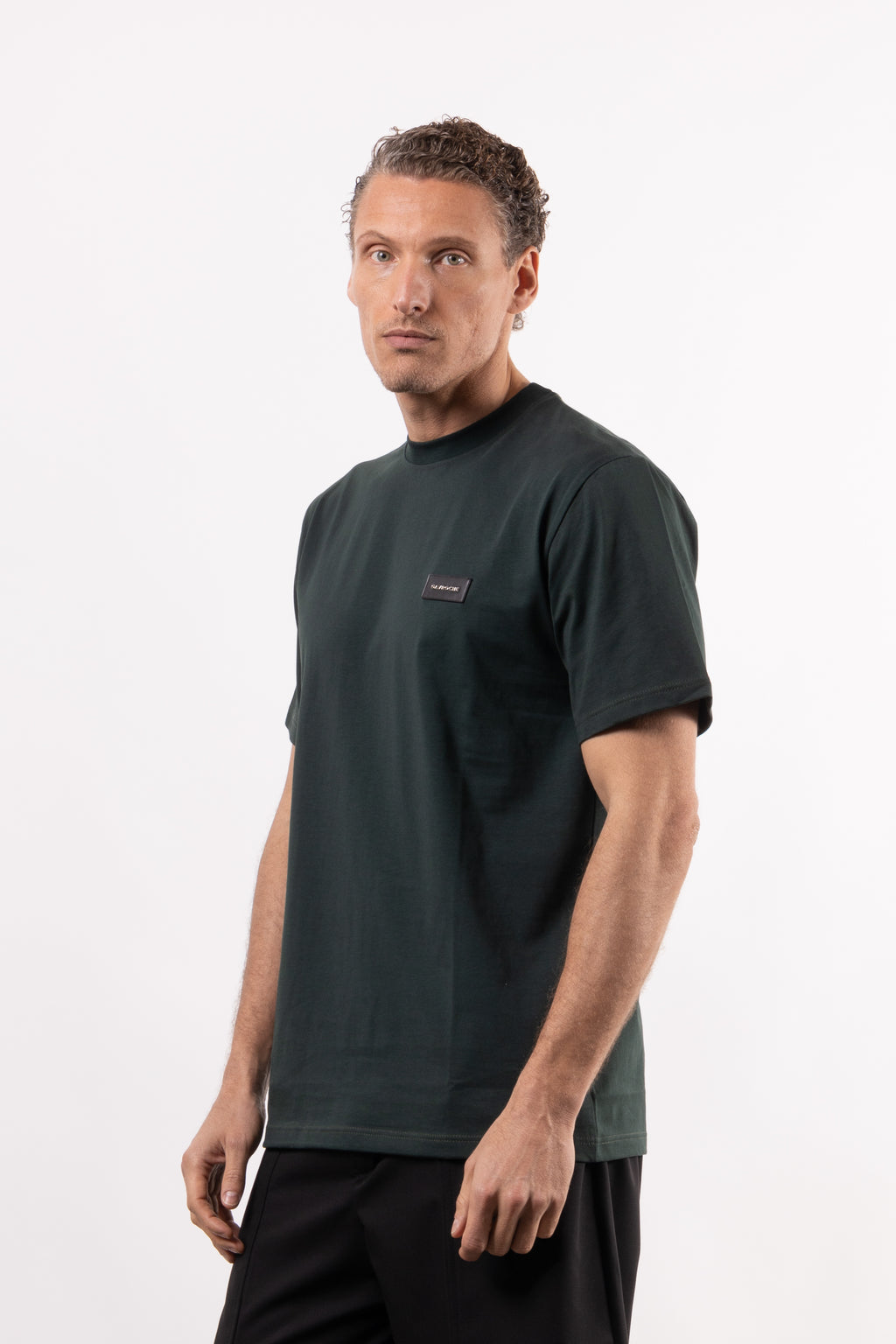 T-shirt in 100% cotone con placchetta in pelle lato cuore