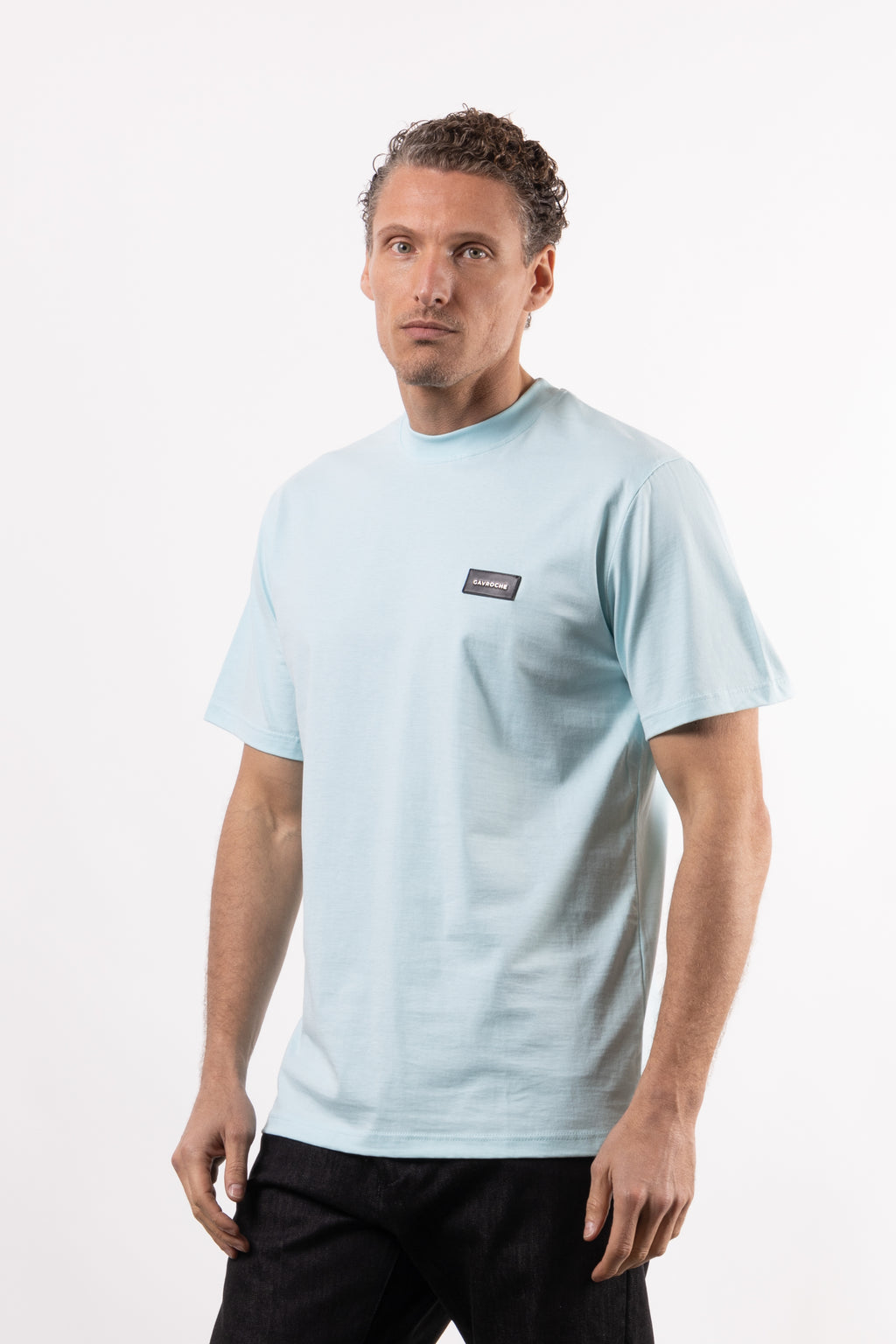 T-shirt in 100% cotone con placchetta in pelle lato cuore
